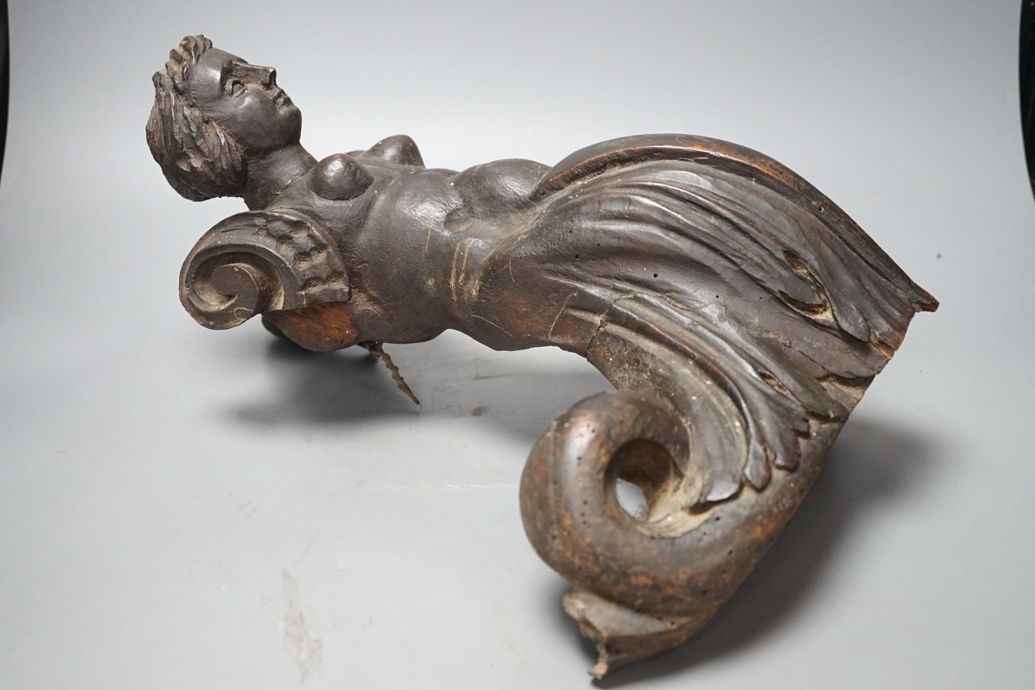 An 18th century Italian carved walnut or beech terminal figure, 38cm